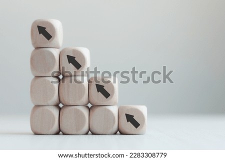 business improvement personal development and growth concept Business people strive to be market leaders and be the best. Comparison concept, wooden block and arrow icon. Royalty-Free Stock Photo #2283308779