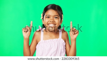 Face, pointing and black girl with motivation, green screen and inspiration with joy, happiness and space. Portrait, African American female child or young person with gesture for direction or choice