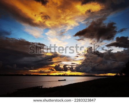 Río Amazonas, Colombia - October 26, 2022 sunset photo over the Amazon River, the Amazon River is one of the main sources of life for the indigenous communities living along its banks, providing fresh