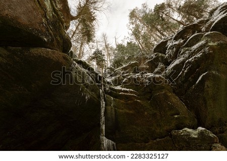 Ice waterfall with rocks in national park Bohemia Switzerland Royalty-Free Stock Photo #2283325127