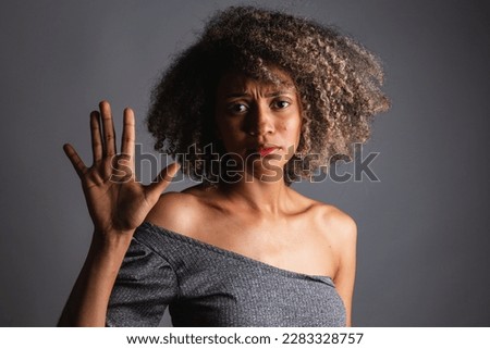 Brazilian black woman, posing for a photo, feminism, fight against racism and domestic violence. Power women. Royalty-Free Stock Photo #2283328757