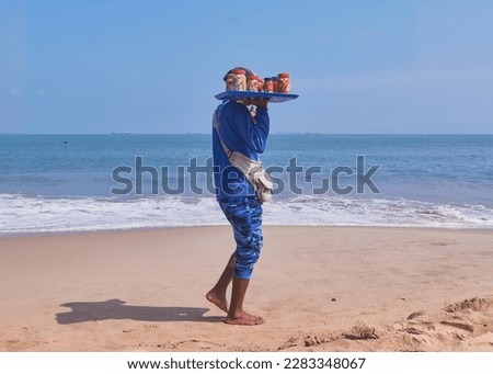 Venezuelan man selling fresh seafood on the beach, Lecheria, Venezuela - stock photo, Man walking the beaches selling seafood