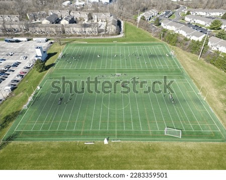 Soccer and Lacrosse fields from an aerial view on a practice field players are practicing their skills