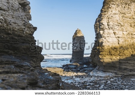 The chalk headland and sheer white cliffs of Flamborough Head on the beach of the North Sea, Yorkshire. High quality photo