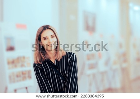 
Happy Smiling Event Host Curating an Exhibition. Cheerful art critic checking out an art gallery event 

 Royalty-Free Stock Photo #2283384395