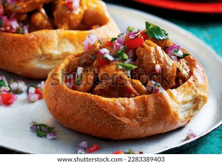 Bunny Chow. The origin of Bunny Chow came from Durban (South Africa) and was first created by the Indians living in this area Royalty-Free Stock Photo #2283389403