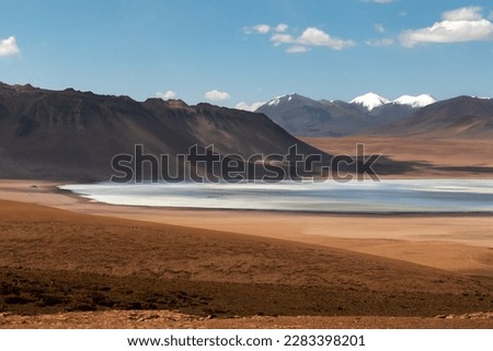 Landscape of snowy mountains and lagoons in Bolivia