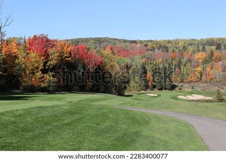 Scenic golf holes in the fall season