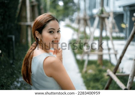 She poses for a photo in a condominium.