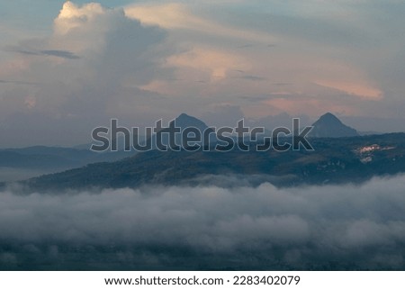 the view of the country above the clouds and the beauty of the mountains in the morning

