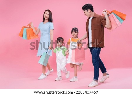 Young Asian family on background