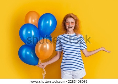 amazed woman with birthday balloon in sunglasses. happy birthday woman hold party balloons