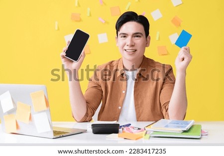 Photo of young Asian businessman working on background