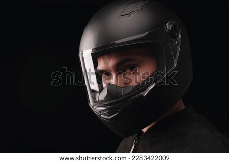 Image of young Asian man with helmet on background Royalty-Free Stock Photo #2283422009