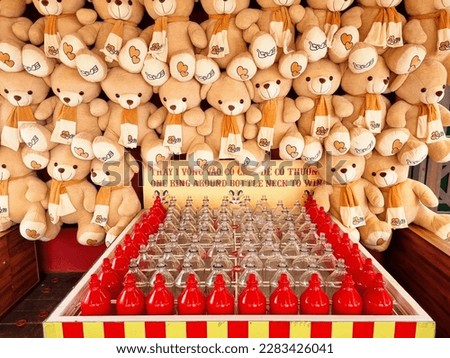 Ring toss carnival game, win a Teddybear, Da Nang Vietnam  Royalty-Free Stock Photo #2283426041