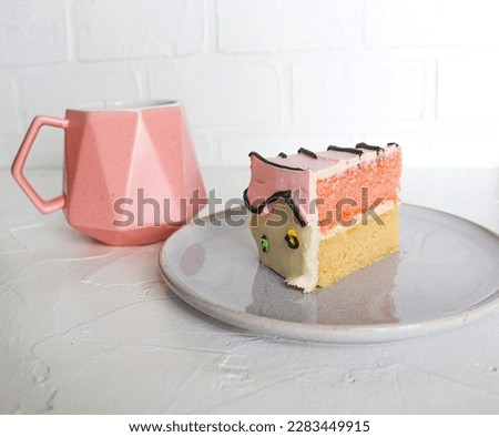 Slice of a cartoon themed birthday cake