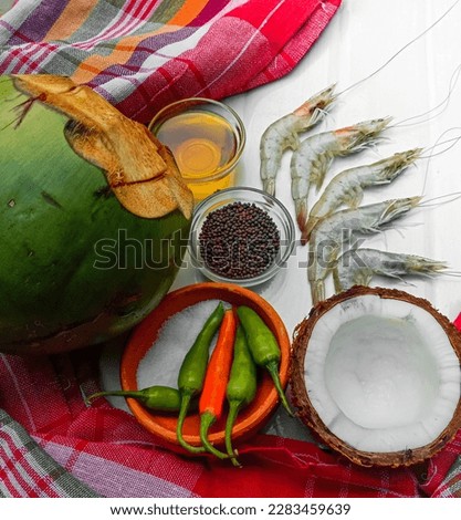 Bengali picture of food preparation of Chingri Malai Curry 