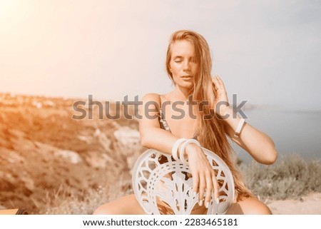 Happy boho woman portrait. Boho chic fashion style. Outdoor photo of free happy woman with long hair, sunny weather outdoors with sea mountains nature beautiful background.