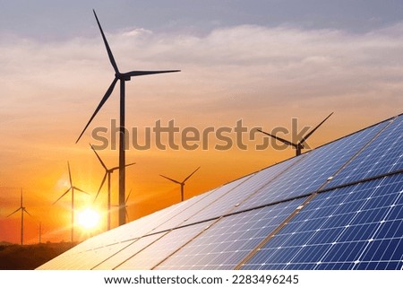 wind turbine with solar panels and sunset. concept clean energy. Energy supply, wind turbine,eolic turbine, distribution of energy,Powerplant,energy transmission,high voltage supply concept Royalty-Free Stock Photo #2283496245