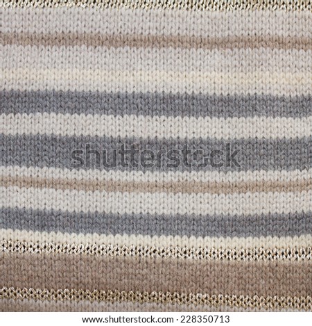 background of knitted woolen pale  gray  and brown stripes  sweater texture