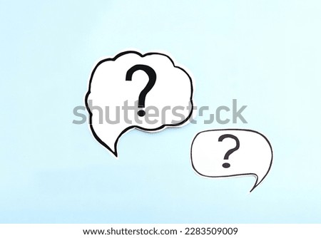 Top view two question mark on speech bubbles on blue background. Ask question concept
