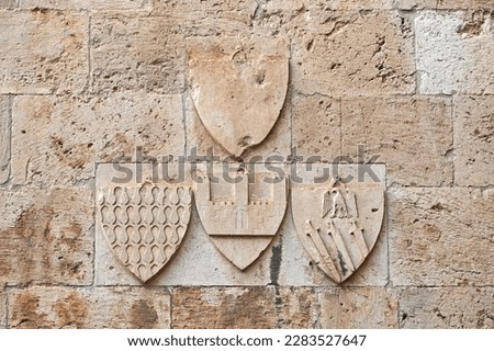 Heraldic symbols, coat of arms, at the Elephant Tower, in the historic city center of Cagliari, Sardinia, Italy Royalty-Free Stock Photo #2283527647