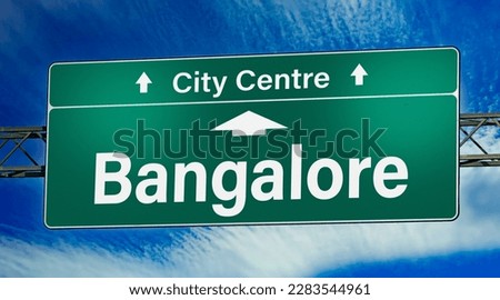 Road sign indicating direction to the city of Bangalore.