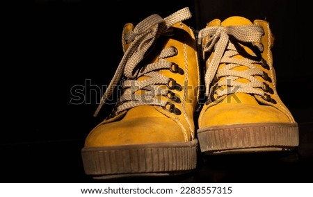 yellow women's winter shoes, close up, background shoes