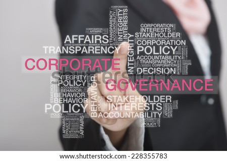Businesswoman touch screen concept with Corporate Governance wordcloud Royalty-Free Stock Photo #228355783