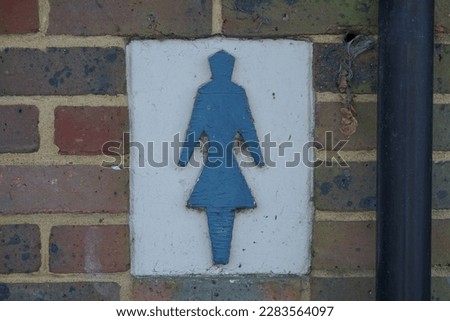 Women's washroom sign on public toilet