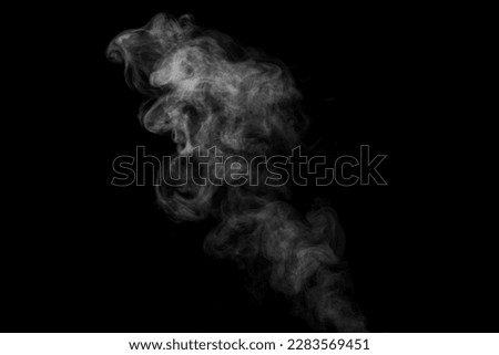 White curling dense smoke steam rising up is isolated on black background to overlay your photos. Steam background
