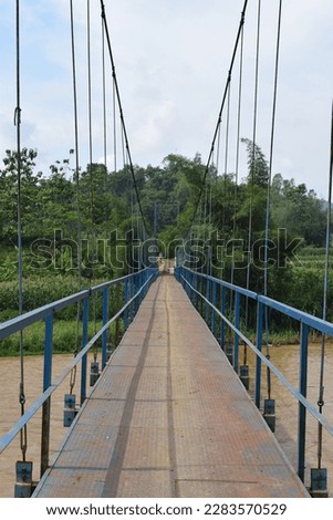 This crossing bridge is an importan means of access to residents from both villages