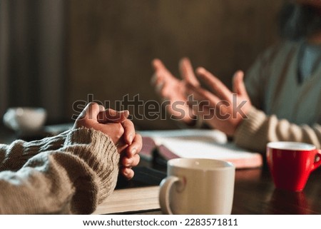 Small group of asian people praying worship believe. Teams of friends worship together before studying Holy bible. family praying together in church. Small group learning with prayer concept.