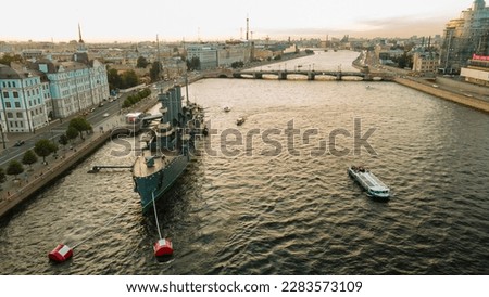 Aerial view of the warship Aurora in historical and at the same time modern city of St. Petersburg on a summer evening, sunset, yellow	 Royalty-Free Stock Photo #2283573109