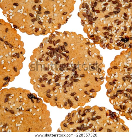 Background of round cookies with sesame and flax seeds