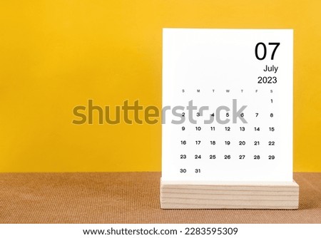 July 2023 Monthly calendar for 2023 year on yellow table. Royalty-Free Stock Photo #2283595309