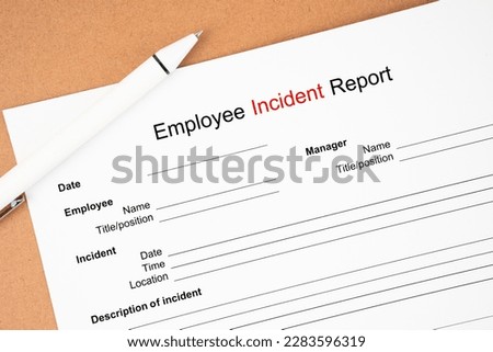 Template of an Employee incident report form document and and pen on wooden background. Royalty-Free Stock Photo #2283596319