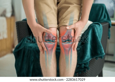 Knee pain, man suffering from osteoarthritis at home, chiropractic treatments concept Royalty-Free Stock Photo #2283617029