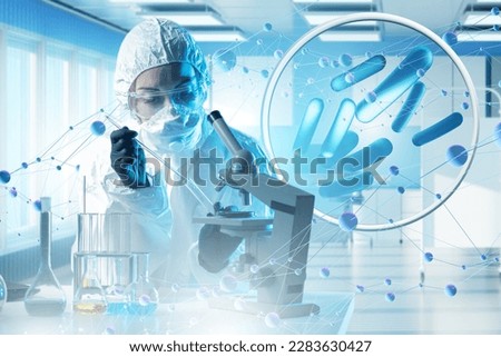 Probiotic products. Concept - yoghurt with probiotic content. Microbiome on purple background. Bifidobacteria for immunity. Probiotics in human hand. White bylots with anaerobic bacteria. Royalty-Free Stock Photo #2283630427