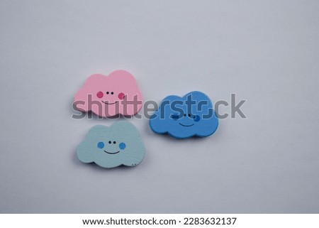 Similarities differences, colorful clouds photographed from above, overlaid on white background.  similarities differences Royalty-Free Stock Photo #2283632137