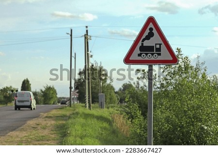 Railway crossing and warning sign