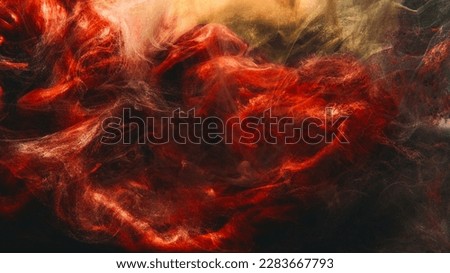 Paint water. Color smoke. Underwater explosion. Red golden glowing glitter fluid splash vapor cloud on dark black abstract art background.