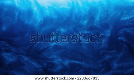 Glitter fluid. Paint water. Ink wave. Sea storm. Blue color glowing shimmering dust particles smoke cloud abstract art background.
