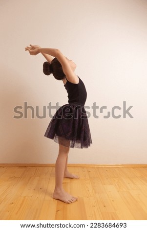 Little cute girl doing gymnastics
