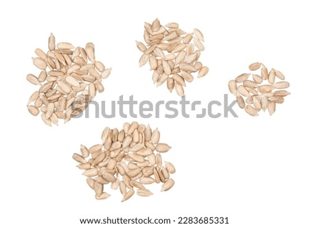 Peeled sunflower seeds isolated on white background, top view.