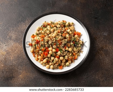 Chickpea Salad with Quinoa, sweet red pepper, herbs and lemon. Healthy food Royalty-Free Stock Photo #2283685733