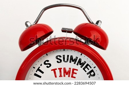 Red alarm clock with text It's Summer Time Royalty-Free Stock Photo #2283694507