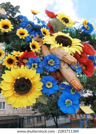 Decoration with artificial flowers and artificial vegetables. Decorative design.