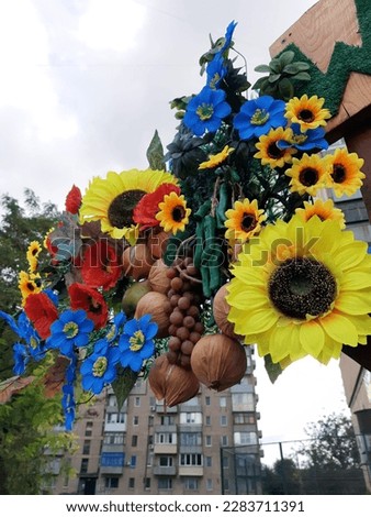 Decoration with artificial flowers and artificial vegetables. Decorative design.