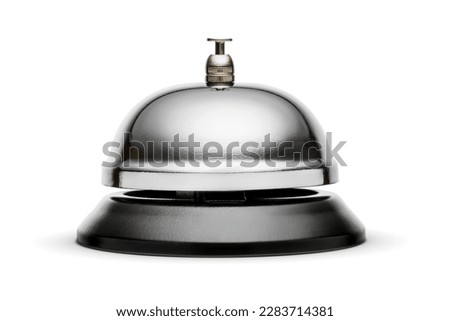 Reception or service bell with a shiny metal surface and a black plastic base. Isolated on white background with clipping path. Royalty-Free Stock Photo #2283714381